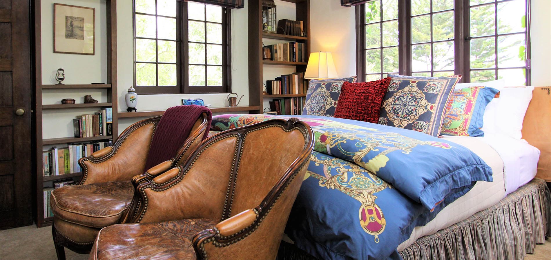 Library Room with bed surrounded by windows