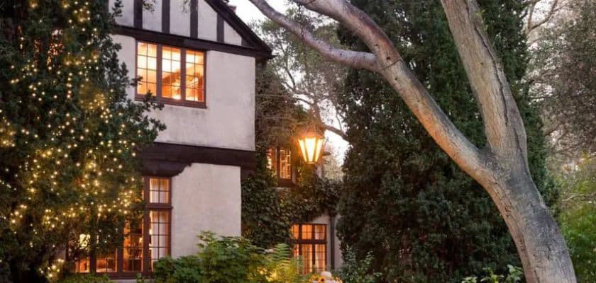 Old Monterey Inn exterior at dusk, with glowing windows and lights in the trees.