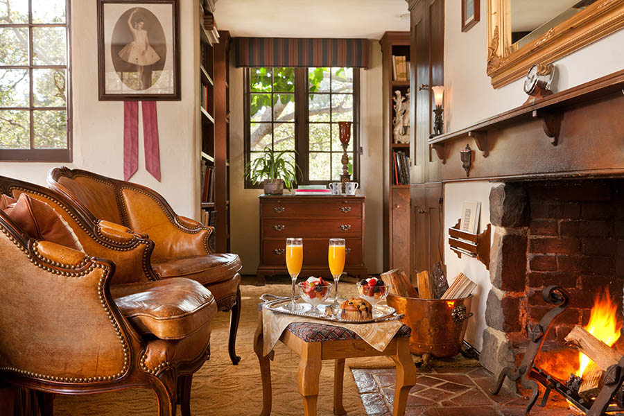 library room at monterey inn with bed and chairs