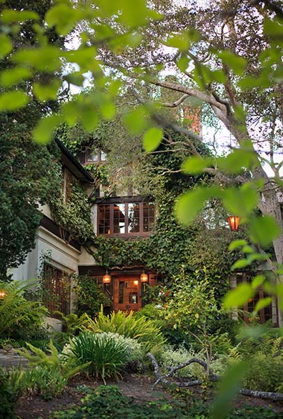 old monterey inn facade with trees